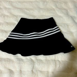 This skirt has shorts under,has only been used once and is a L